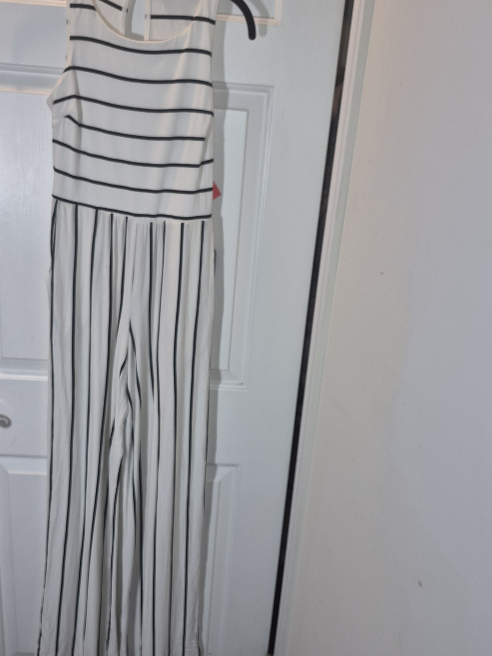 Sleeveless White Jumpsuit with Black Stripe Detail